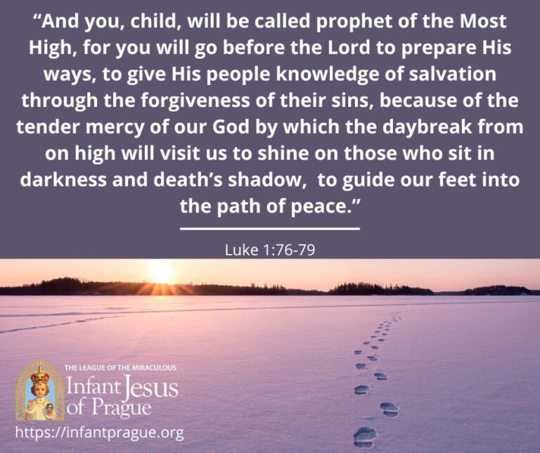 footprints in snow disappearing into the distance with distant sunset and tree silhouettes.