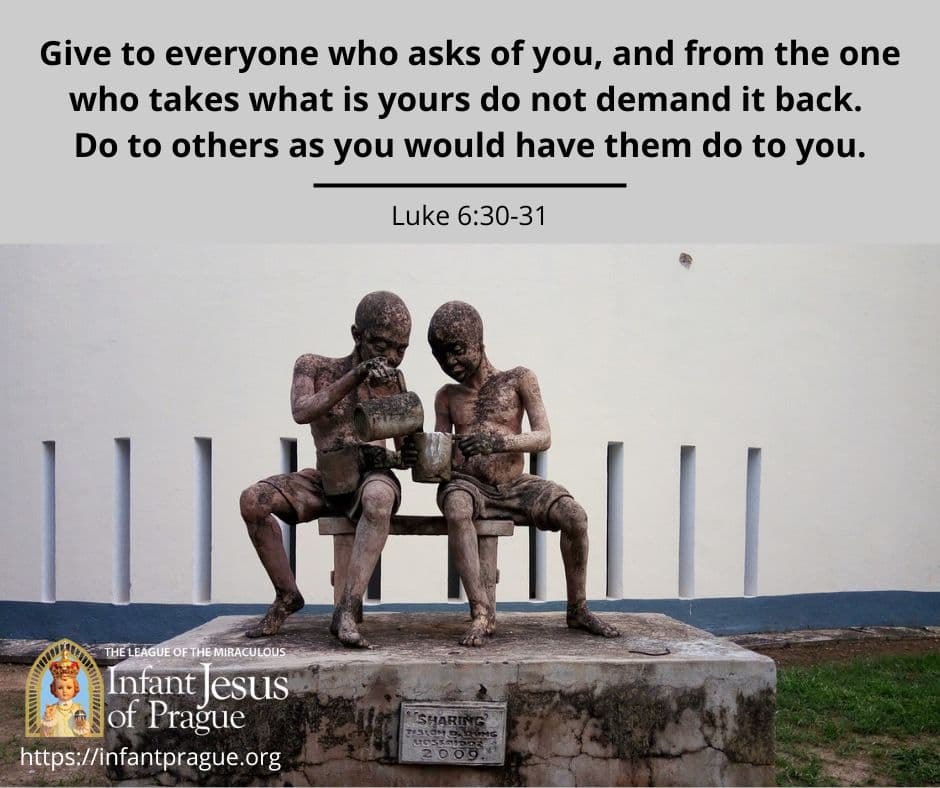 stone statue of two children depicting one child sharing with the other