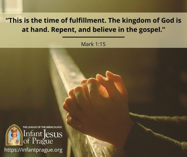 prayer hands with interlocked fingers resting on a wooden pew