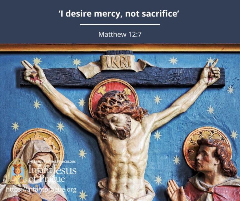 Painted wood carving of Jesus crucified.